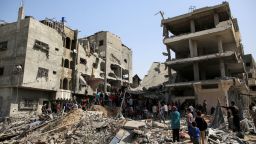 Palestinians gather at the site of an Israeli strike on a house in Gaza City on October 26, 2024.