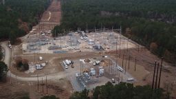 Duke Energy workers repair a crippled electrical substation that they said was hit by gunfire after the Moore County Sheriff said that vandalism caused a mass power outage, in Mineral Springs near Pinehurst, North Carolina, U.S. December 6, 2022.  REUTERS/Drone Base