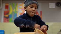 Jean Luis Hernandez helps make pies for the homeless at Robert F. Wagner Middle School in New York City, on November 18.