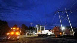 Duke Energy personnel work to restore power at a crippled electrical substation in Carthage, North Carolina, on December 4.