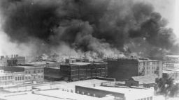 FILE - In this 1921 image provided by the Library of Congress, smoke billows over Tulsa, Okla., during the Tulsa Race Massacre, one of the worst single acts of violence against Black people in U.S. history. Attorneys for the last two remaining survivors of the massacre asked the Oklahoma Supreme court Tuesday, July 2, 2024, to reconsider the case they dismissed last month and called on the Biden administration to help the two women seek justice. (Alvin C. Krupnick Co./Library of Congress via AP, File)